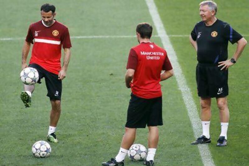 When he first saw Ryan Giggs, left, Sir Alex Ferguson, right, said the then 13 year old "floated across the ground like a cocker spaniel chasing a piece of silver paper in the wind".