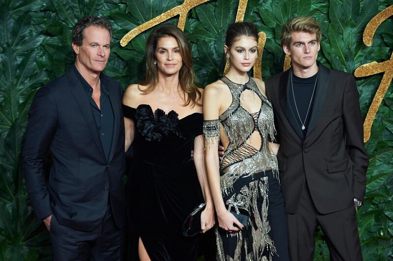 epa07222600 (L-R) Rande Gerber, his wife US model Cindy Crawford, her daughter Kaia Jordan Gerber (L) and her brother Presley arrive for The Fashion Awards in London, Britain, 10 December 2018. The Fashion Awards is showcasing both British and international individuals and businesses who have made the most outstanding contributions to the fashion industry.  EPA/Niklas Halle'n