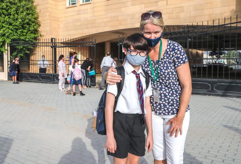 Abu Dhabi, United Arab Emirates, August 30, 2020.  Children return to school on Sunday after months off due to the Covid-19 pandemic at the Brighton College, Abu Dhabi.--  Johnny Archer, nine and mother, Anna.
Victor Besa /The National
Section:  NA
Reporter:  Haneen Dajani