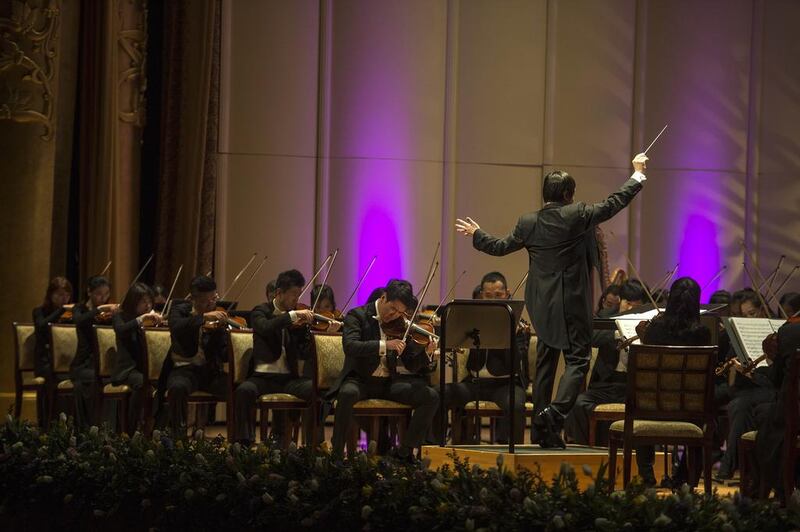 Conductor Yi Zhang leads China's National Centre for the Performing Arts Orchestra at Emirates Palace. Courtesy Abu Dhabi Festival