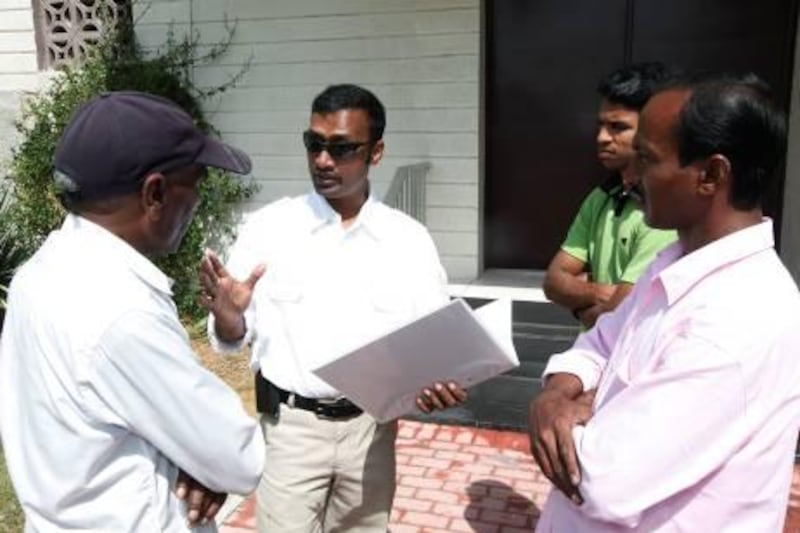 Dubai , United Arab Emirates- February, 24 , 2011:  Imran Choudhury(C)  talks to the Bangladeshi workers  about his new  association to help & support Bangladeshis living in Dubai.  ( Satish Kumar / The National ) 