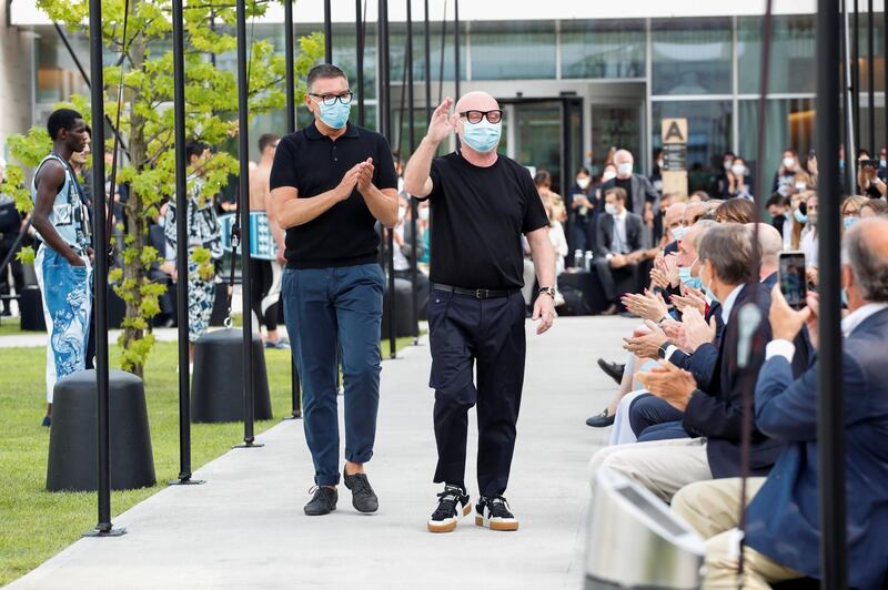 Italian designers Domenico Dolce and Stefano Gabbana acknowledge the applause at the end of their Spring / Summer 2021 men's collection in a live-streamed show during Milan Digital Fashion Week. Reuters