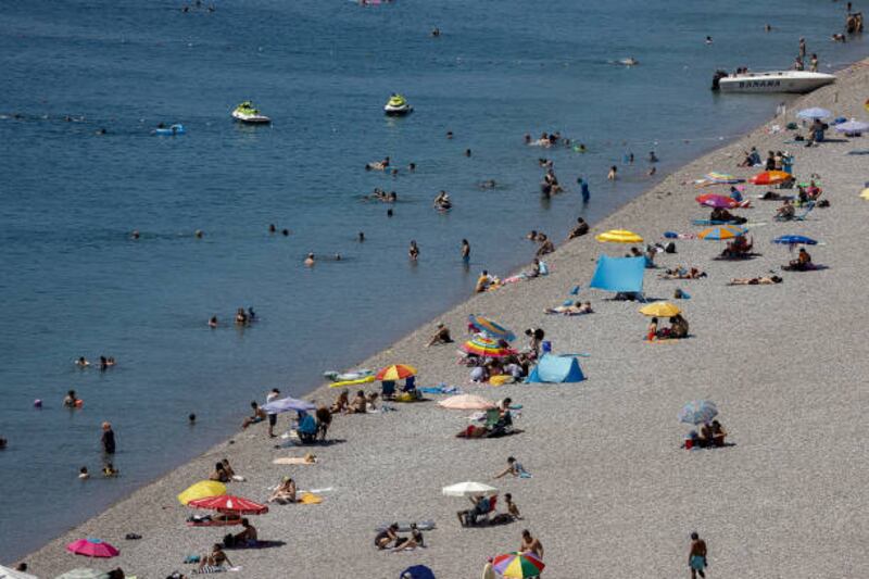 People enjoy Konyaalti beach in Antalya, Turkey. The country had expected to be moved to Britain's amber list. Getty Images