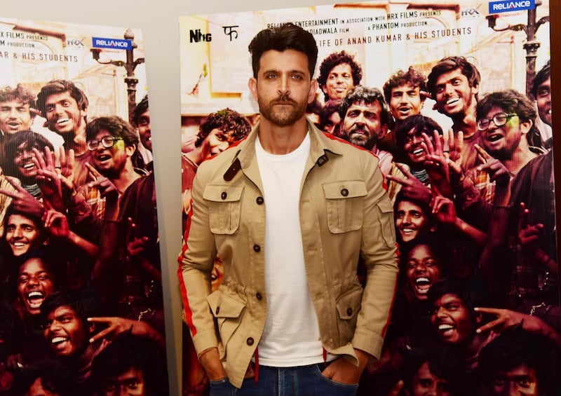 Bollywood actor Hrithik Roshan poses for photographs during the promotion of his film 'Super 30' at the 92.7 Big FM 'Come Together to Change Perspectives' event in Mumbai on July 19, 2019. (Photo by Sujit Jaiswal / AFP)