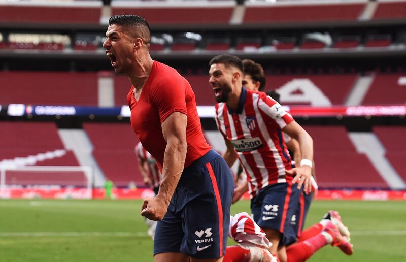 MADRID, SPAIN - MAY 16: Luis Suarez of Atletico Madrid celebrates after scoring their team's second goal  during the La Liga Santander match between Atletico de Madrid and C.A. Osasuna at Estadio Wanda Metropolitano on May 16, 2021 in Madrid, Spain. Sporting stadiums around Spain remain under strict restrictions due to the Coronavirus Pandemic as Government social distancing laws prohibit fans inside venues resulting in games being played behind closed doors.  (Photo by Denis Doyle/Getty Images)