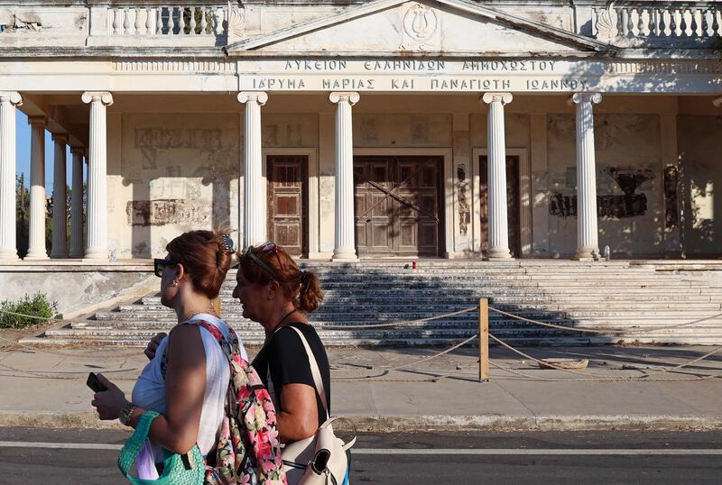 People walk past an art school in Varosha. It’s expected Mr Erdogan will open up more parts of the area.