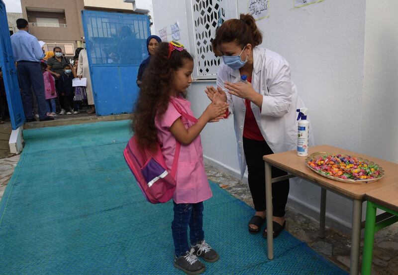 Tunisian pupils arrive at primary school in the Ariane region near Tunis.  AFP