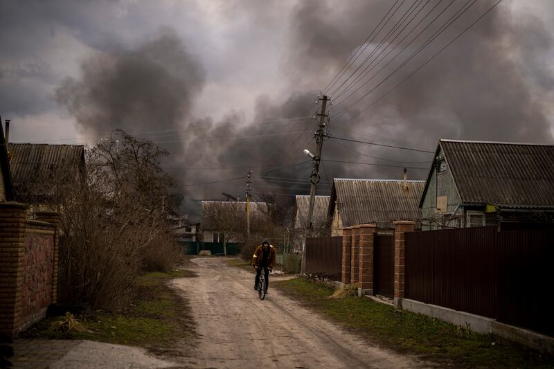 Smoke rises after a building was struck during Russia's military offensive in Irpin on Sunday. AP