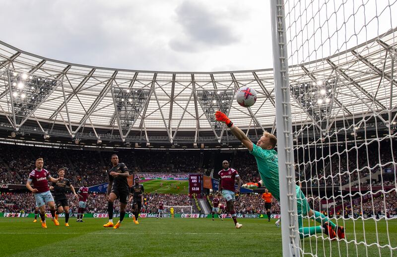 Jarrod Bowen of West Ham United scores his team's second goal past Aaron Ramsdale of Arsenal during the 2-2 Premier League draw at London Stadium on April 16, 2023 in London, England. Getty Images