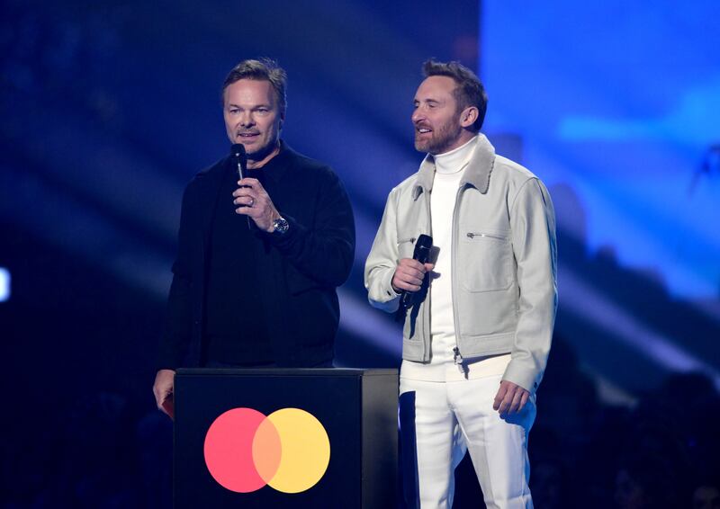 Pete Tong and David Guetta present an award. Getty Images