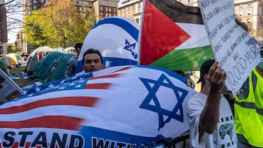 Pro-Israel students stand nearby as Columbia University students participate in a pro-Palestinian encampment on their campus in New York City on Tuesday. AFP