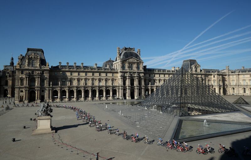 The peloton pass the Louvre in Paris. Reuters