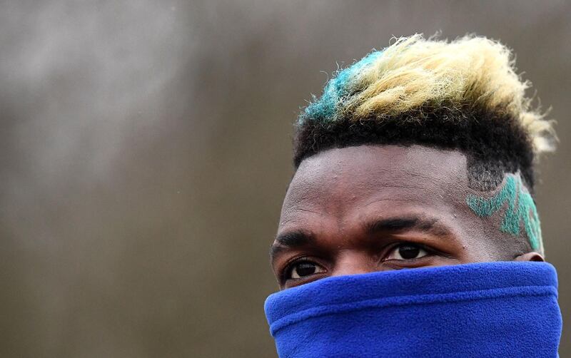 France's midfielder Paul Pogba reacts during a training session in Clairefontaine-en-Yvelines, southwest of Paris, on March 19, 2018, as part of the team's preparation for the friendly football matches against Colombia and Russia.   / AFP PHOTO / FRANCK FIFE