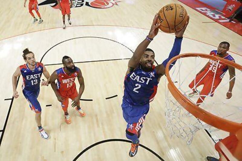 Eastern Conference All-Star Kyrie Irving, of the Cleveland Cavaliers, goes up for a dunk during the NBA All-Star Game on Sunday night. Eric Gay / AP Photo