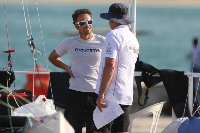 Past Volvo winner Frank Cammas talks to an official during the ISAF Sailing World Cup in Abu Dhabi on Saturday, November 29, 2014. DELORES JOHNSON / The National