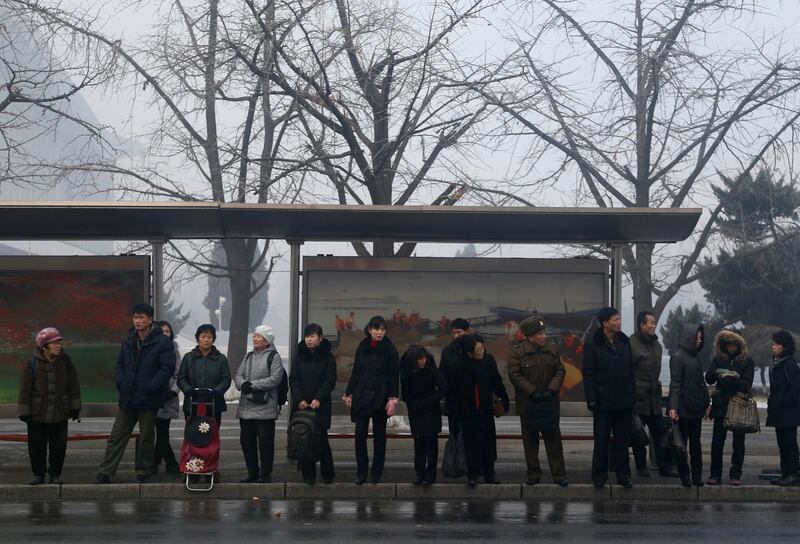 North Koreans wait for trolley bus at a bus stop in downtown Pyongyang, North Korea. AP Photo