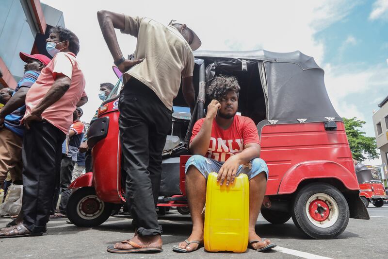 People wait to buy petrol at a fuel station in Colombo, Sri Lanka, in May 2022. EPA