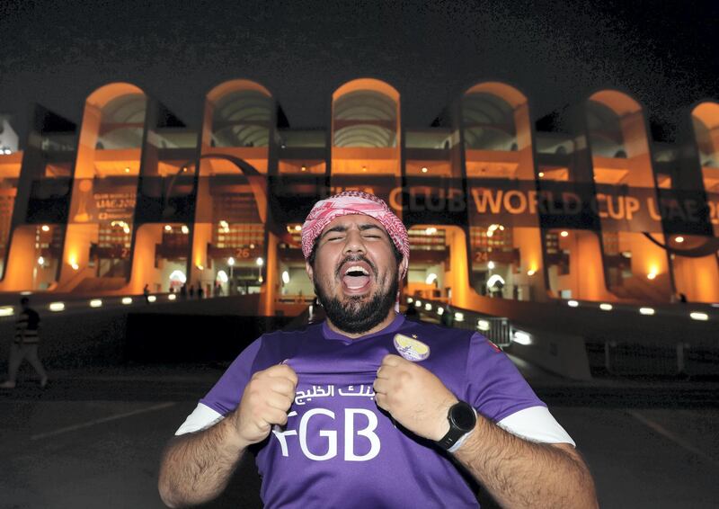Abu Dhabi, United Arab Emirates - December 19, 2018: An Al Ain fan celebrates his teams victory before the game between Real Madrid and Kashima Antlers in the Fifa Club World Cup semi final. Wednesday the 19th of December 2018 at the Zayed Sports City Stadium, Abu Dhabi. Chris Whiteoak / The National