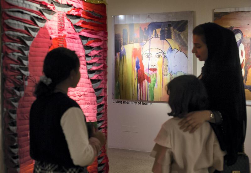 Sharjah, United Arab Emirates - Guests looking at Dr. Azra Aksamija's art at Sharjah Museum of Islamic Civilization.  Leslie Pableo for The National for Salam Al Amir's story