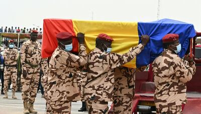 Chad army officers carry the coffin of late Chadian President Idriss Deby Itno during the state funeral in N'Djamena on April 23, 2021. Chad's President Idriss Deby died on April 20, 2021 from wounds sustained in a battle with rebels in the country's north, an army spokesperson announced on state television. Deby had been in power since 1990 and was re-elected for a sixth term in the April 11, 2021 elections. / AFP / Issouf SANOGO
