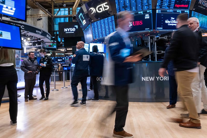 Traders work on the floor of the New York Stock Exchange on the first trading day of 2024. AFP
