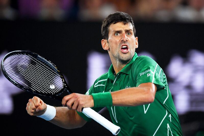 epa08178397 Novak Djokovic of Serbia reacts during his semi final match against Roger Federer of Switzerland at the Australian Open Grand Slam tennis tournament at Rod Laver Arena in Melbourne, Australia, 30 January 2020.  EPA/LUKAS COCH AUSTRALIA AND NEW ZEALAND OUT