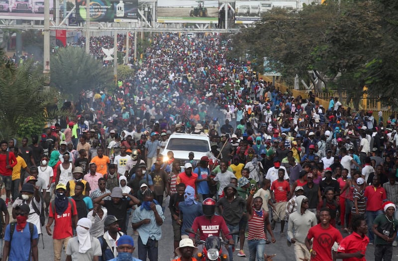 Demonstrators participate in an anti-government protest in Port-au-Prince. Reuters