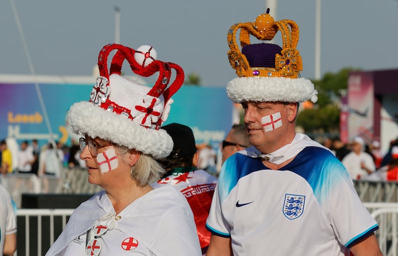 England fans en route to the game against Iran. EPA