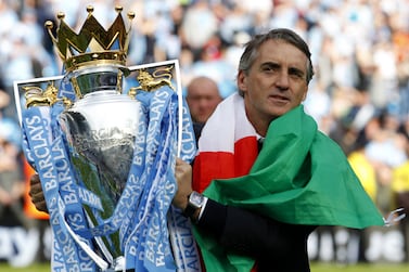 File photo dated 13-05-2012 of Manchester City manager Roberto Mancini celebrates with the trophy. Roberto Mancini's City clinched the title, but only at the end of a roller-coaster season. Issue date: Thursday May 12, 2022.
