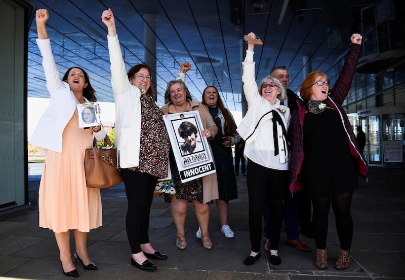 Family members of the victims gesture outside the International Conference Centre after listening to the findings of the report into the fatal shootings of 10 people in the Ballymurphy area of Belfast in 1971 that involved the British Army, at an inquest held, in Belfast, Northern Ireland, May 11, 2021. REUTERS/Clodagh Kilcoyne