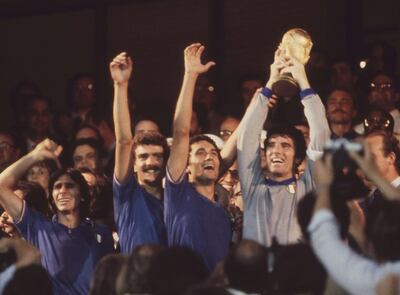 FILE - The July 11, 1982 file photo shows Italian captain and goalkeeper Dino Zoff, right, holding the World Cup trophy aloft,after the presentation ceremony, at the Santiago Bernabeu Stadium, Madrid. The best coaches in Italy emigrate. The stadiums around the country are falling apart. The lingering problems affecting Italy's domestic league might just be the reason for the country's failure to qualify for next year's World Cup. (AP Photo)