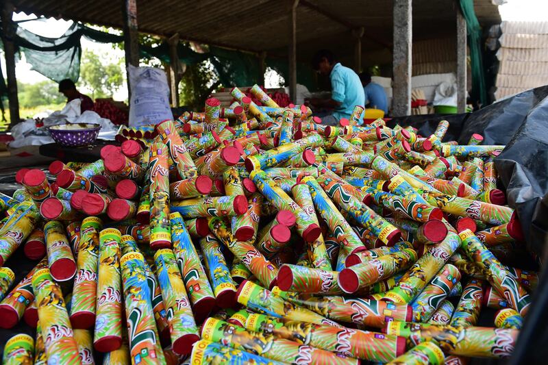 Workers assemble firecrackers at a workshop in the outskirts of Ahmedabad ahead of Diwali. AFP