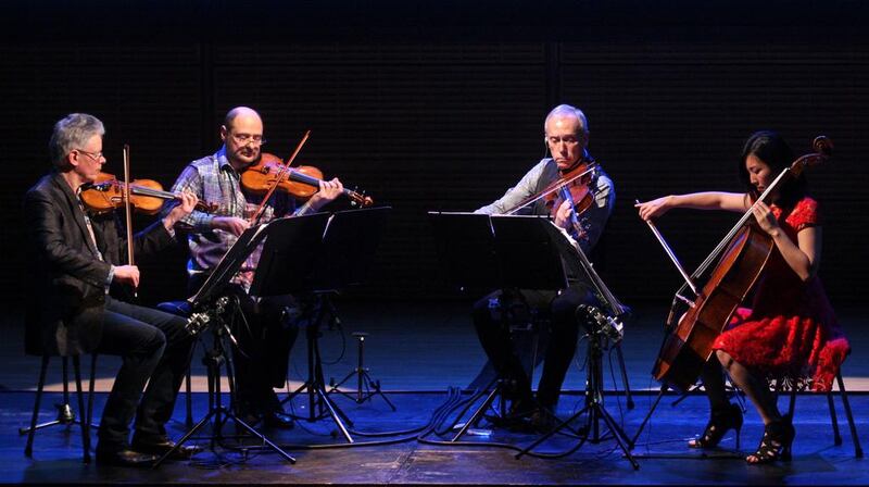 The Kronos Quartet in performance, above, from left: David Harrington, John Sherba, Hank Dutt and Sunny Yang. Hiroyuki Ito / Getty Images