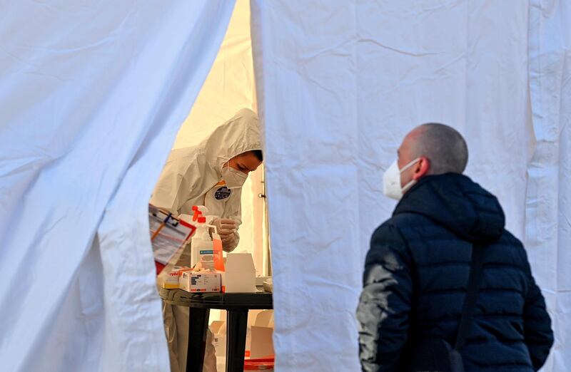 A Polish commuter waits for a coronavirus test at the Stadtbruecke border crossing between Germany and Poland. Poland is classified as a 'high risk' area by German authorities. AP Photo