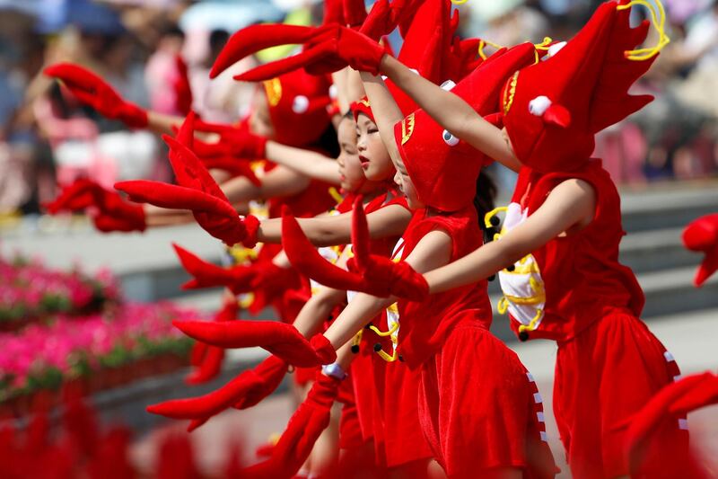 Children dressed in crayfish costumes perform during the opening ceremony of a crayfish festival in Xuyi, Jiangsu province, China. Reuters