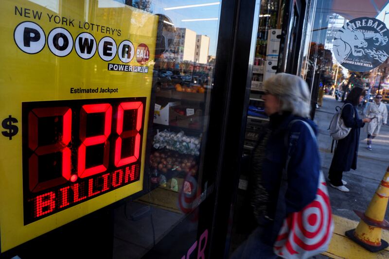 A screen advertises the Powerball jackpot of $1.2 billion at a store in Brooklyn, New York. Reuters