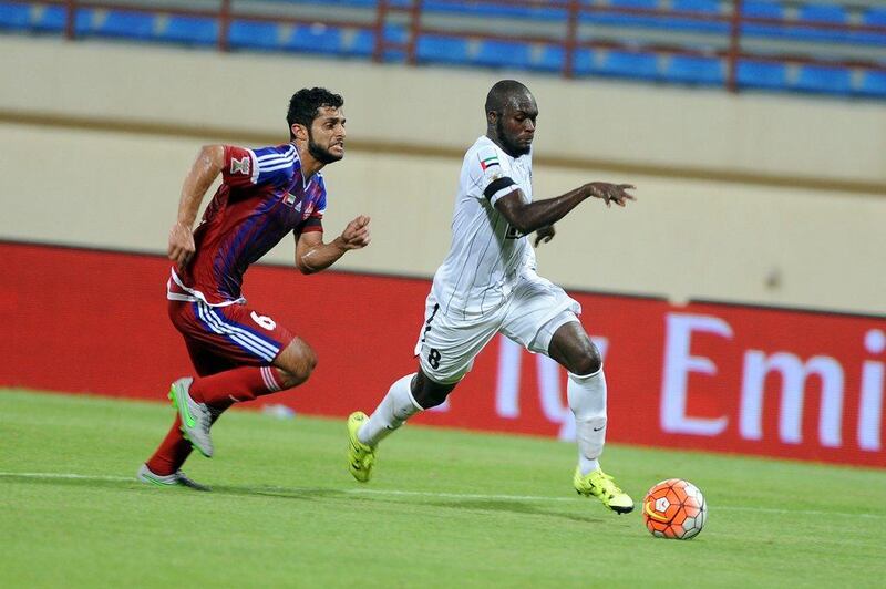 Moussa Sow, right, of Al Ahli in action during the Arabian Gulf Cup match between Al Shaab and Al Ahli at Khalid bin Mohammed Stadium on September 7, 2015. Hosam Elbaz/Al Ittihad