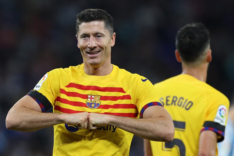 Barcelona's Robert Lewandowski celebrates scoring his team's third goal. AFP