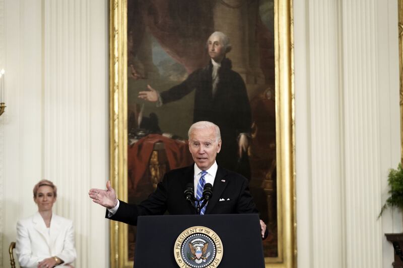 Mr Biden speaks to a packed East Room in the White House. UPI / Bloomberg