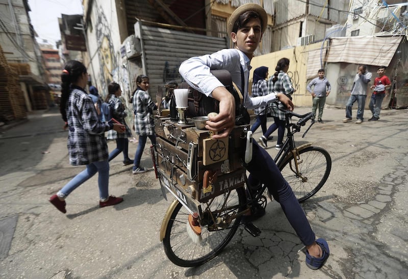 Mohammad Khaled Jahjah is south Beirut's dapper barber on a bike. All photos by Joseph Eid / AFP Photo