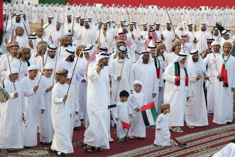 AL WATHBA, ABU DHABI, UNITED ARAB EMIRATES - December 03, 2017: HH Sheikh Mohamed bin Zayed Al Nahyan Crown Prince of Abu Dhabi Deputy Supreme Commander of the UAE Armed Forces (centre L), dances, during the Sheikh Zayed Heritage Festival. Seen with HH Sheikh Zayed bin Mohamed bin Hamad bin Tahnoon Al Nahyan (4th L), HH Sheikh Khalifa bin Tahnoon bin Mohamed Al Nahyan, Director of the Martyrs' Families' Affairs Office of the Abu Dhabi Crown Prince Court (C), and other dignitaries.
( Mohamed Al Suwaidi for Crown Prince Court - Abu Dhabi )
---