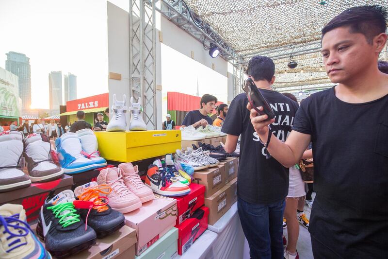 Dubai, United Arab Emirates- Visitors checking out shoes in one of the brand outlet at the Sole Dubai Festival at D3.  Leslie Pableo for The National for Saeed Saeed's story