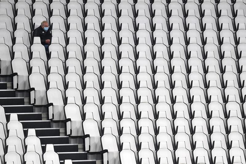 A supporter sits in the stands before the cancelled the Serie A match between Juventus and Napoli. Getty Images