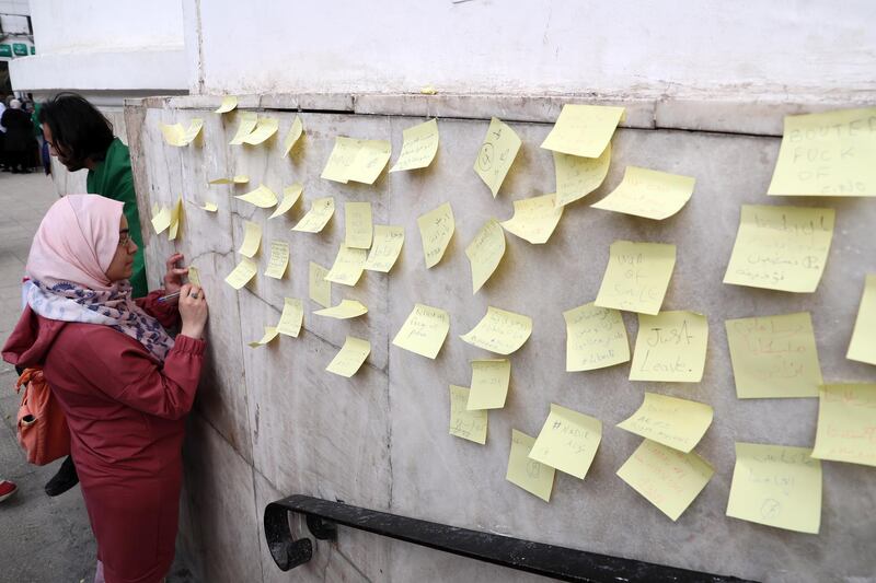People write slogans and messages on sticky notes during a protest against President Abdelaziz Bouteflika in Algiers, Algeria. EPA