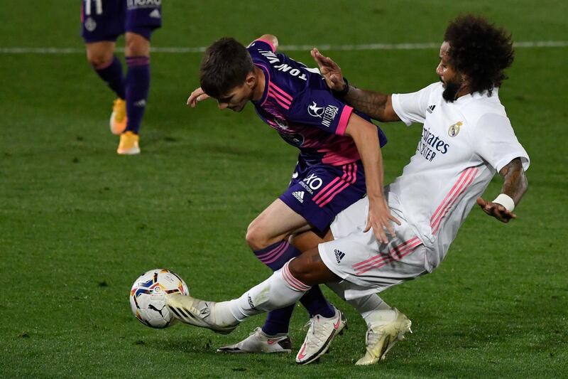 Real Madrid defender Marcelo challenges Valladolid's Spanish midfielder Toni Villa. AFP