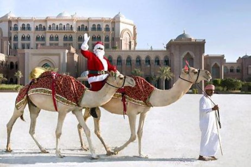 Santa arrives in Abu Dhabi on a camel. Courtesy Emirates Palace