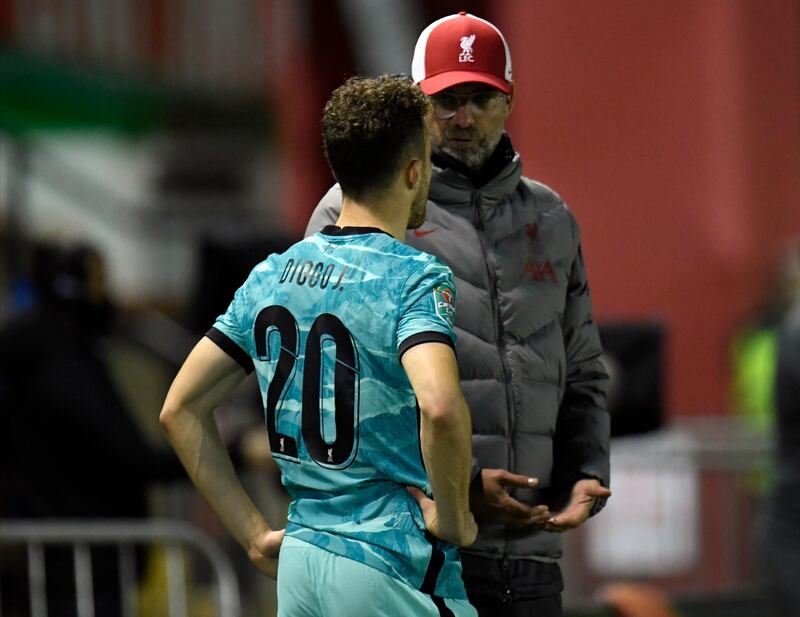 Liverpool manager Juergen Klopp gives instructions to Diogo Jota. EPA