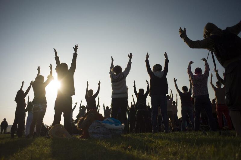 Revellers perform yoga as they celebrate the summer solstice on Salisbury Plain. Stonehenge is a celebrated venue of festivities during the summer solstice — the longest day of the year in the northern hemisphere — and it attracts thousands of revellers, spiritualists and tourists. Druids, a pagan religious order dating back to Celtic Britain, believe Stonehenge was a centre of spiritualism more than 2,000 years ago. Kieran Doherty / Reuters