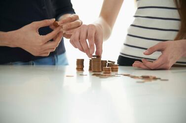  Teenagers look to their parents to set the right example when it comes to managing finances. Getty Images