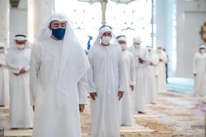 ABU DHABI, UNITED ARAB EMIRATES - May 13, 2021: HH Sheikh Abdullah bin Zayed Al Nahyan, UAE Minister of Foreign Affairs and International Cooperation (L), attends Eid Al Fitr prayers at the Sheikh Zayed Grand Mosque. 

( Mohamed Al Hammadi / Ministry of Presidential Affairs )
---